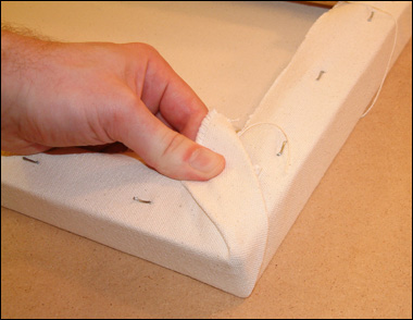 How to Stretch Canvas: A Tutorial with Step-by-step Instructions Twist the corner over to one side