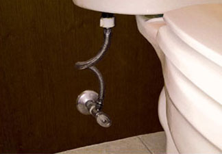 Example of a traditional style of toilet supply installation